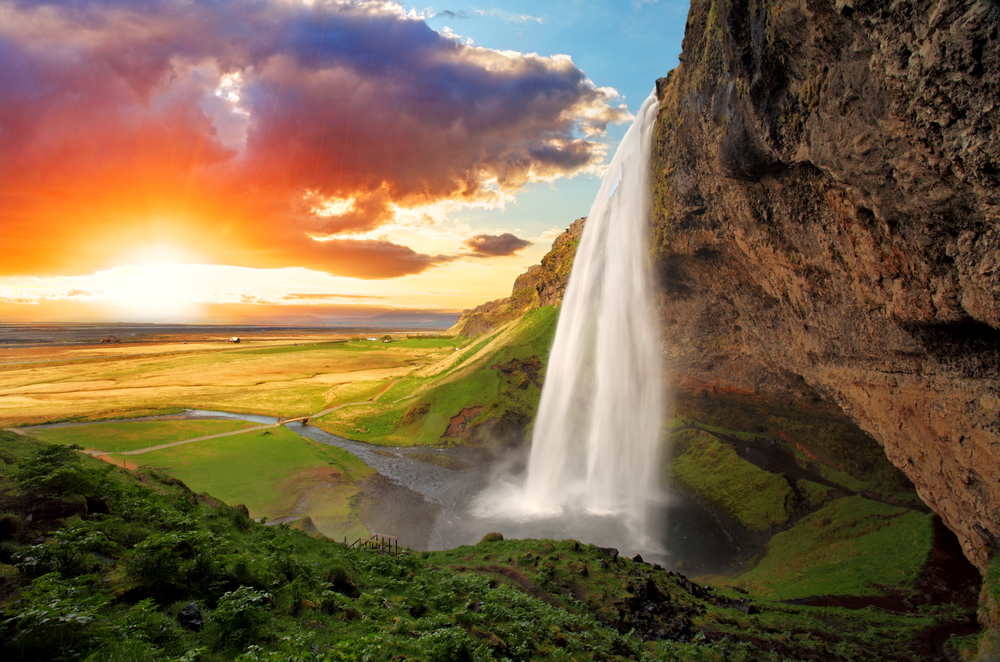 Sun setting near a waterfall in Iceland