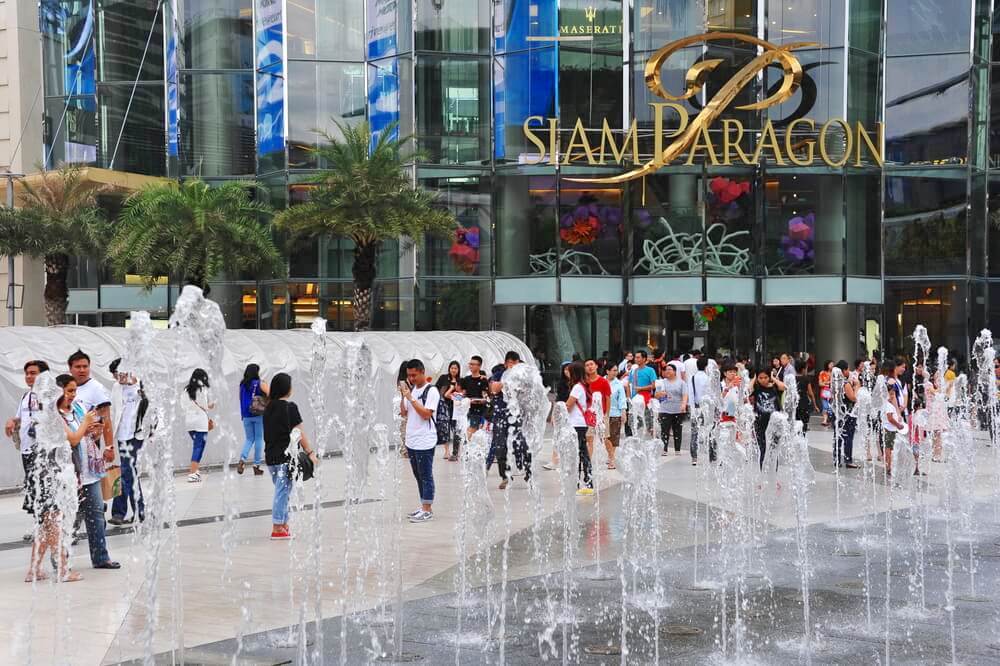 BANGKOK - AUG 25: Shoppers visit Siam Paragon mall in the Siam Square area on Aug 25, 2013 in Bangkok, Thailand. With 300,000 sq m of retail space Siam Paragon is one of the world's largest malls.
